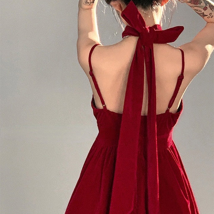 Red velvet halter dress by FJØRNA featuring a fitted silhouette, perfect for stylish streetwear and Y2K-inspired fashion.