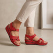 Red FJØRNA orthopedic open toe wedge heel sandals with comfort fit, featuring a supportive wedge design and stylish open toe style.