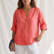Red women's summer blouse by FJØRNA with V-neck, linen fabric, and button front, perfect for warm weather.