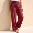 Red linen summer trousers for women with button front by FJØRNA, stylish and breathable for warm weather.