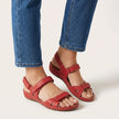 Red FJØRNA orthopedic flat ankle strap sandals for women with adjustable fit and supportive design.