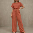 FJØRNA Coastal Breeze textured two-piece lounge set with red wide-leg pants and matching top, perfect for casual comfort.