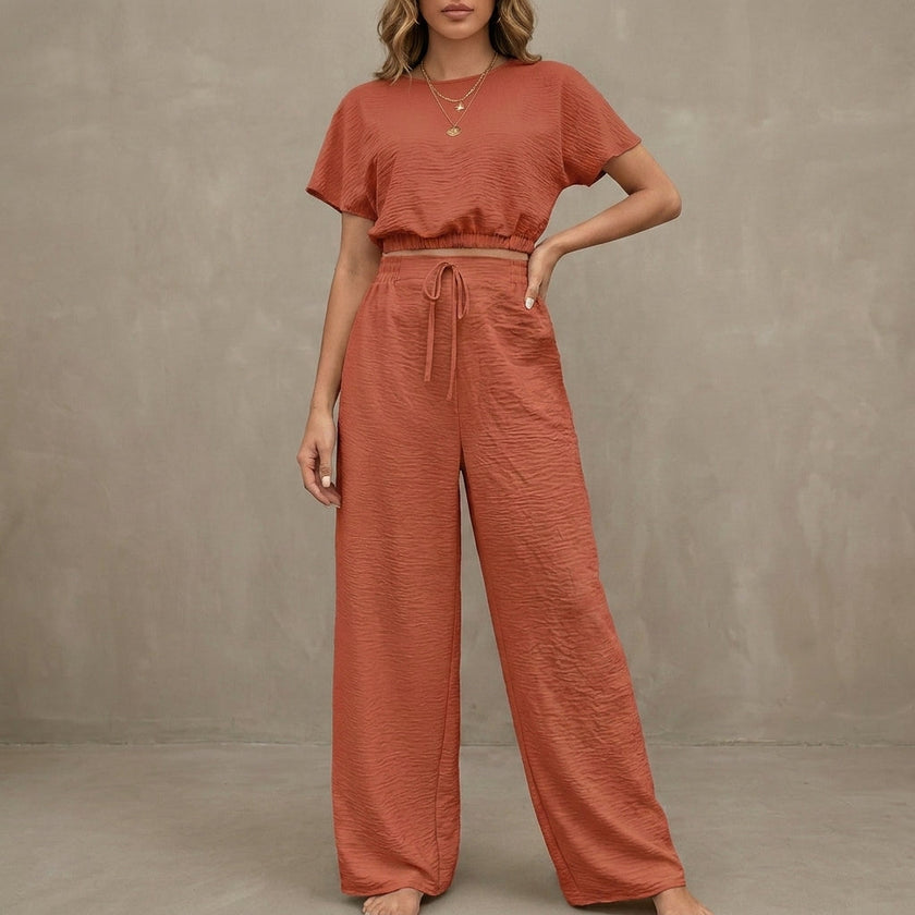 FJØRNA Coastal Breeze textured two-piece lounge set with red wide-leg pants and matching top, perfect for casual comfort.