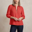 Red FJØRNA summer women's blouse with long sleeves and smocked design, featuring a stylish, relaxed fit.