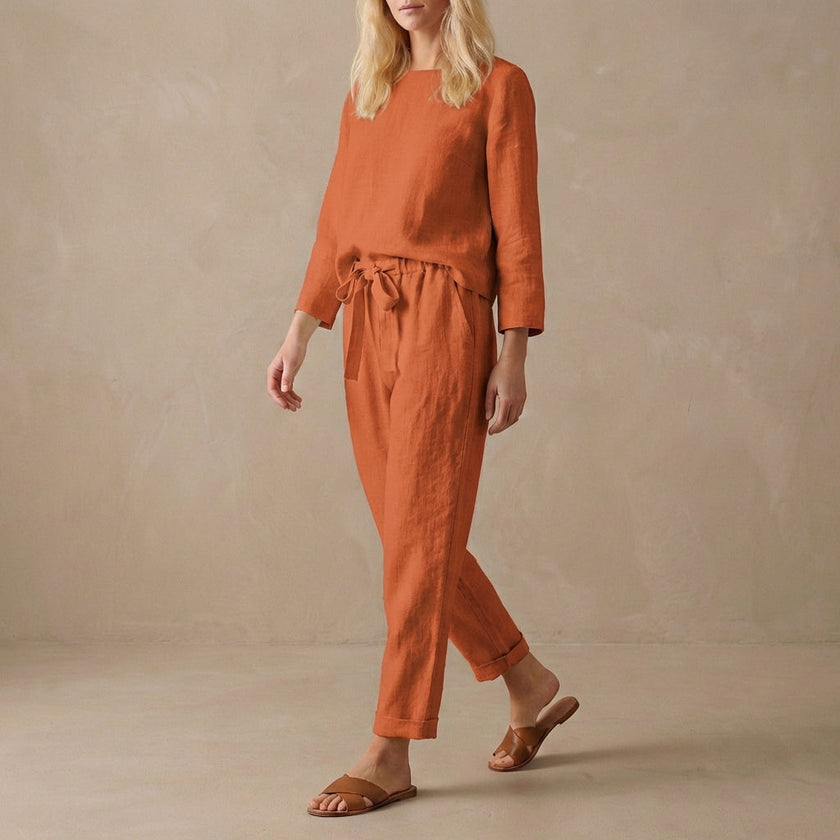 FJØRNA relaxed linen two-piece set with red boat neck blouse and drawstring linen pants, casual and comfortable clothing ensemble.