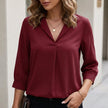 Red women's summer blouse by FJØRNA with V-neck, puff sleeves, and high waist, perfect for warm-weather stylish outfits.