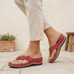 Red FJØRNA orthopedic open toe wedge flip-flops with floral embellishments, featuring comfortable sandal design and decorative flower details.