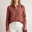 Red striped summer blouse for women by FJØRNA featuring long sleeves and a button-front design.