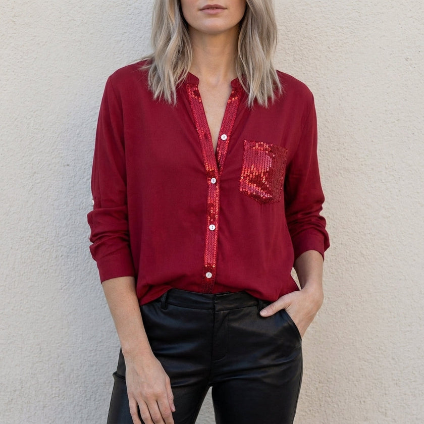 Red FJØRNA women's summer blouse with V-neck and denim button front, stylish top for warm weather.