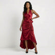 Red satin halter neck maxi dress with bow tie waist and ruffled hem by FJØRNA, featuring a flowing silhouette and elegant design.