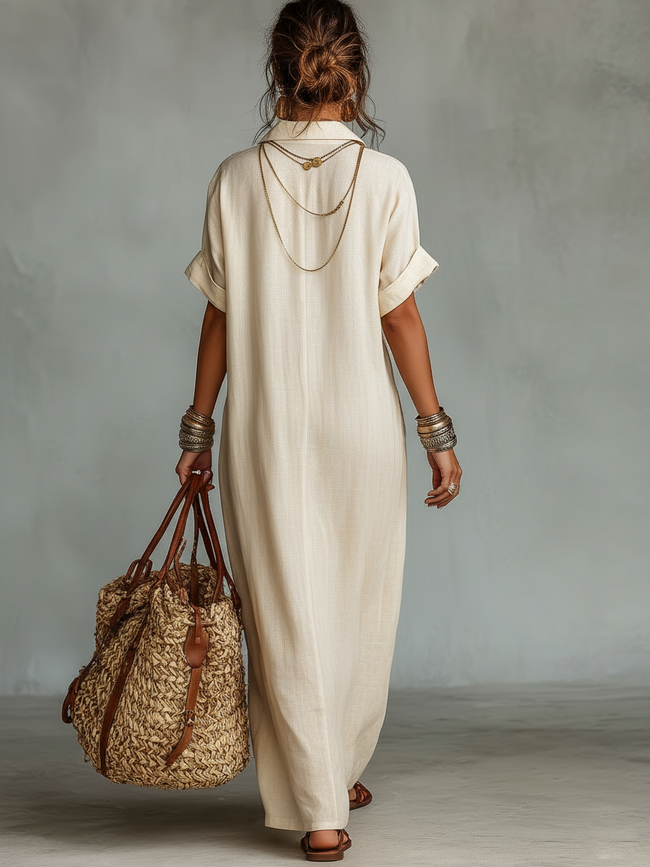 Red linen embroidered maxi dress for women by FJØRNA featuring a flowing silhouette and intricate embroidery detail.