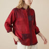Red FJØRNA women's summer blouse with geometric V-neck, lightweight top featuring a stylish design and comfortable fit.