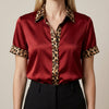 FJØRNA women's summer blouse featuring a leopard print with short sleeves in vibrant red fabric.