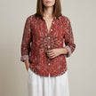 Red floral linen summer blouse for women with V-neck and long sleeves, by FJØRNA, stylish and lightweight top.