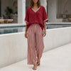 Red FJØRNA summer two-piece women's co-ord set with striped high-waist design, featuring a crop top and matching skirt.