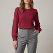 Red FJØRNA women's long sleeve denim pleated summer blouse with a relaxed fit and stylish design.