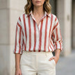 FJØRNA women's summer blouse with red and white striped long sleeves, lightweight and stylish for warm weather.