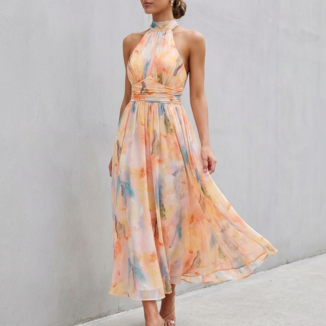 Reddish-orange pleated belted A-line halter neck maxi dress for women by FJØRNA, flowing fabric with a stylish silhouette.