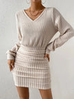 FJØRNA ribbed knit mini dress featuring a fitted silhouette and long sleeves, shown in a close-up view.