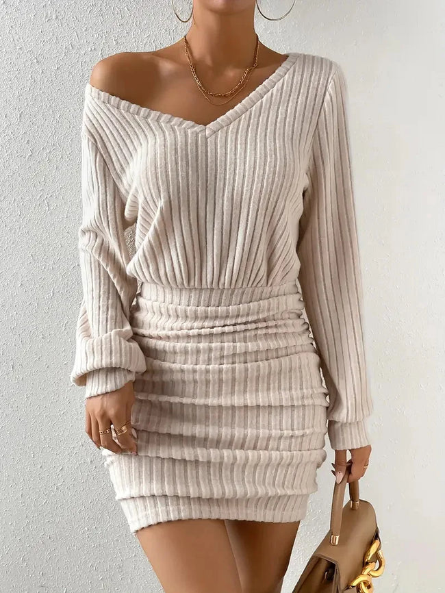 FJØRNA ribbed knit women's mini dress, stylish and fitted for party or day wear, featuring a textured ribbed knit fabric.