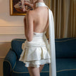 FJØRNA rose satin backless women's mini dress for party and cocktail events, shown in a stylish satin fabric with a backless design.