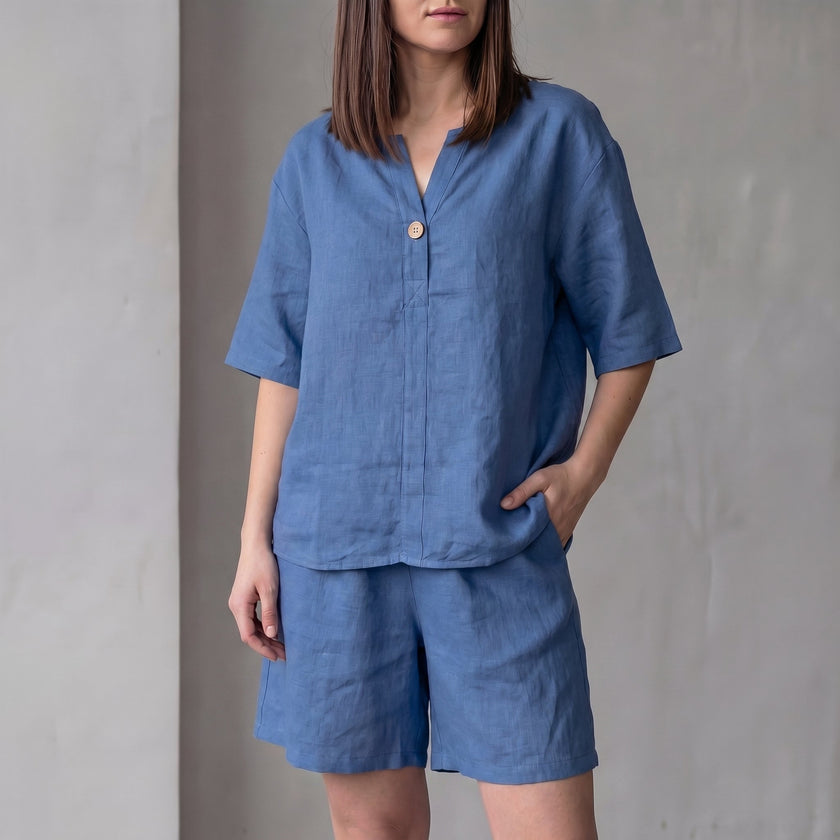 Royal blue oversized woven two-piece set by FJØRNA featuring a V-neck shirt and high-waist shorts, casual and stylish.