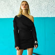 FJØRNA ruched bodycon mini dress shown from the front, featuring fitted silhouette and elegant ruching detail.