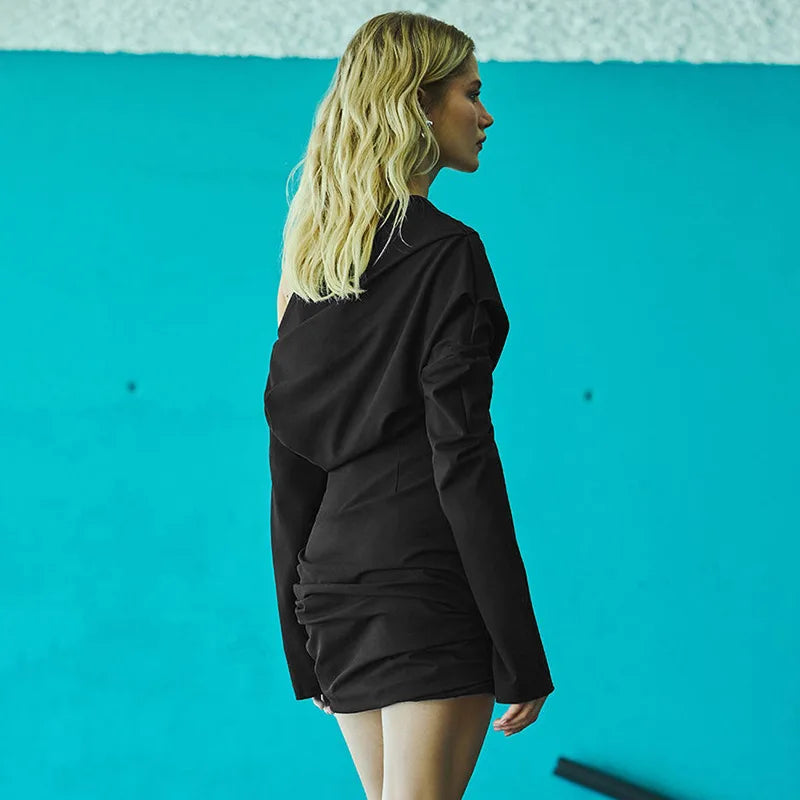 FJØRNA ruched bodycon mini dress showing a fitted silhouette with ruched detailing and short sleeves.