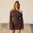 FJØRNA ruched bodycon mini dress displayed on a hanger, showcasing fitted silhouette and ruched detailing in soft fabric.