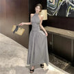FJØRNA ruched halter midi dress featuring a fitted bodice and flowing skirt, perfect for elegant occasions.