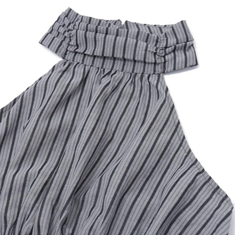 FJØRNA ruched halter midi dress featuring a fitted bodice and flowing skirt, perfect for elegant occasions.