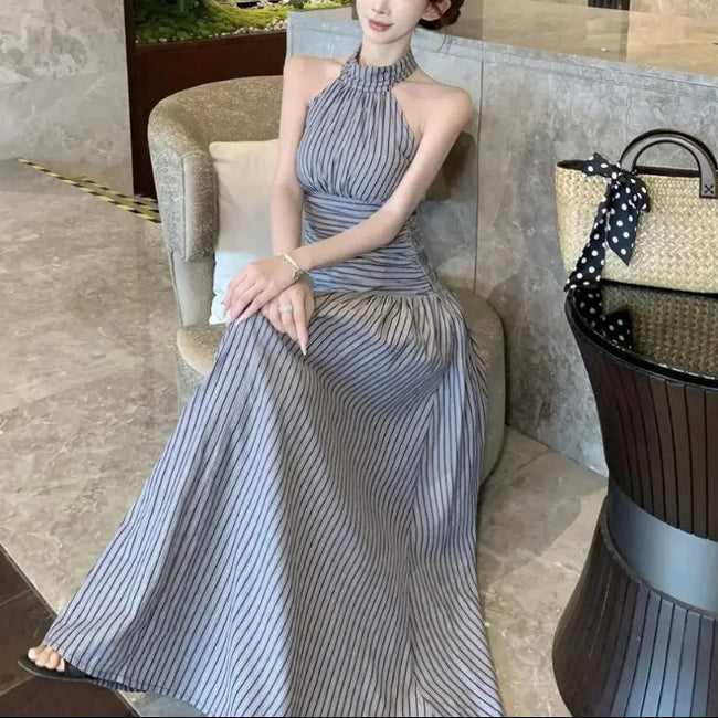 FJØRNA ruched halter women's midi dress featuring a stylish design, perfect for day-to-night wear, shown in the image.
