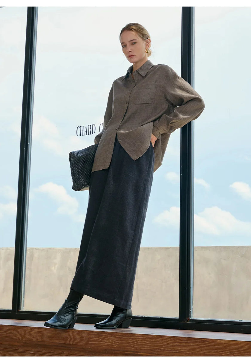 Women’s linen blend shirt by FJØRNA, casual tops with long sleeves and a relaxed fit, shown in soft neutral fabric.