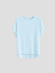 FJØRNA oversized tee with rolled cuffs, soft fabric, relaxed fit, and casual style, shown on a model.