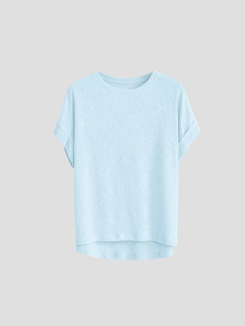 FJØRNA oversized tee with rolled cuffs, soft fabric, relaxed fit, and casual style, shown on a model.