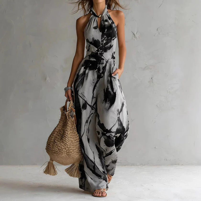 FJØRNA Madison Flowy Halter Maxi Dress in white, elegant sleeveless dress with flowing fabric and halter neckline.