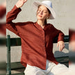 FJØRNA women's linen V-neck shirt, lightweight and breathable tops for women, displayed in a natural fabric and relaxed fit.