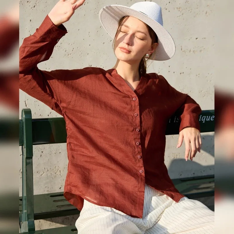 Women’s linen V-neck shirt by FJØRNA, light and breathable top with a relaxed fit, shown in soft neutral color.