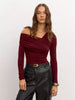 Women’s off-shoulder cotton top by FJØRNA, featuring a stylish design and comfortable fit, shown on a model.