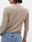 FJØRNA women's knit cardigan, long-sleeve tops, soft and cozy, beige color, styled with buttons and ribbed cuffs.