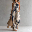FJØRNA Madison Flowy Halter Maxi Dress in white, elegant sleeveless dress with a flowing design and halter neckline.