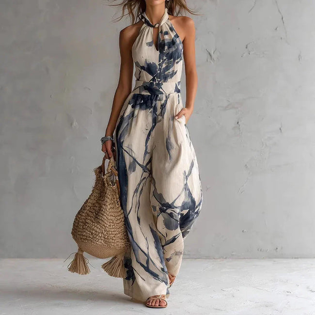 FJØRNA Madison Flowy Halter Maxi Dress in white, elegant sleeveless dress with a flowing design and halter neckline.