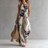 FJØRNA Madison Flowy Halter Maxi Dress in white, elegant sleeveless dress with a flowing design and halter neckline.