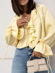 FJØRNA satin blouse for women with ruffle detail, stylish tops featuring elegant fabric and feminine design.