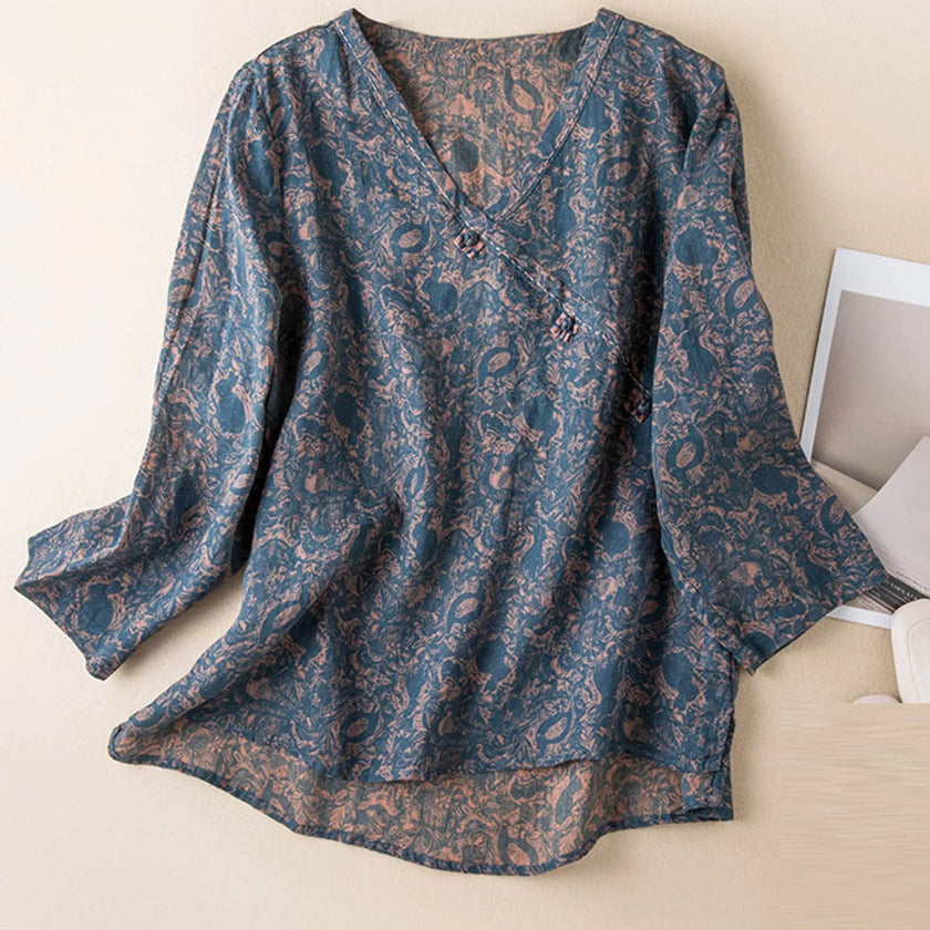 FJØRNA linen blend long sleeve women's blouse with a relaxed fit, lightweight fabric, and classic collar, displayed on a hanger.