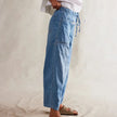 FJØRNA women's cotton pull-on jeans, casual pants with a comfortable fit and classic denim style in a natural pose.