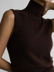 FJØRNA women's sleeveless wool vest, stylish top in neutral color, close-up view highlighting soft fabric and tailored fit.