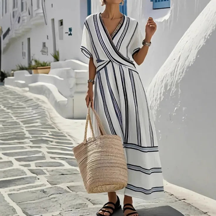 FJØRNA Carter Summer Elegant Dress, casual wedding dress in lightweight fabric with a flowy silhouette and delicate design.