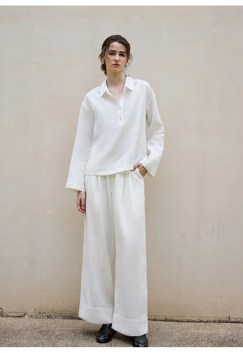 FJØRNA women's linen polo top with collar, lightweight and breathable, shown in a relaxed fit with short sleeves.