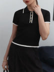 FJØRNA women's cotton polo top, casual short-sleeve shirt with collar and buttons, in white fabric.
